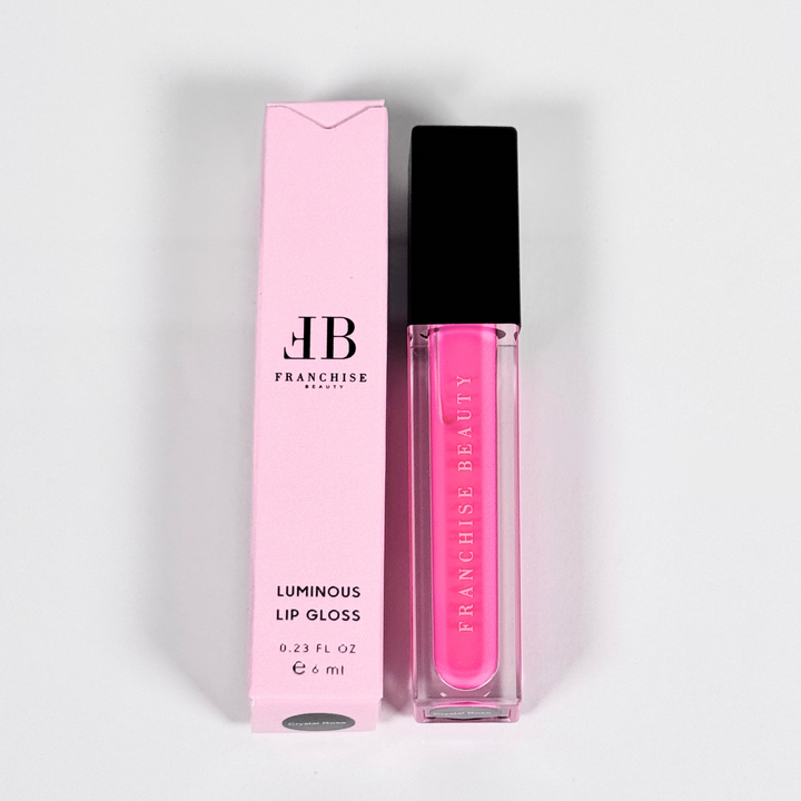 Close-up of pigmented pink Crystal Rose lip gloss with recyclable packaging