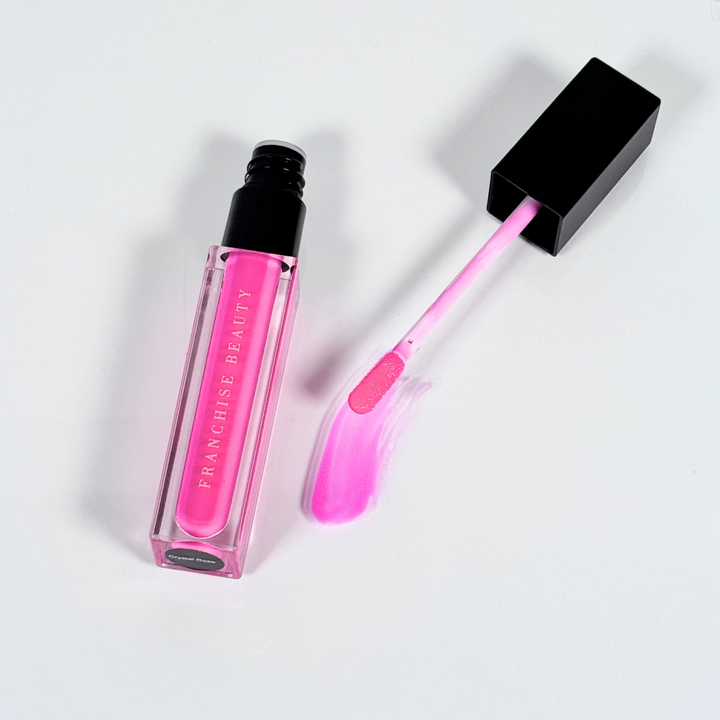 Crystal Rose vibrant fuchsia lip gloss in clear tube with glossy finish
