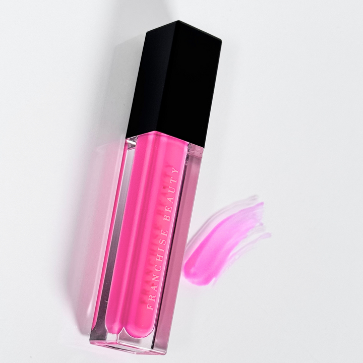 Crystal Rose vibrant fuchsia lip gloss in clear tube with glossy finish