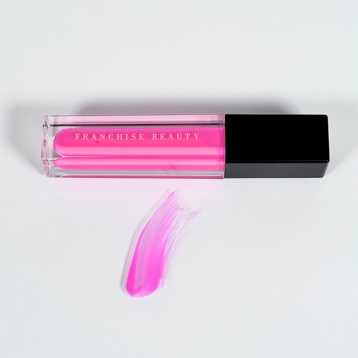 Crystal Rose vibrant fuchsia lip gloss in clear tube with glossy finish