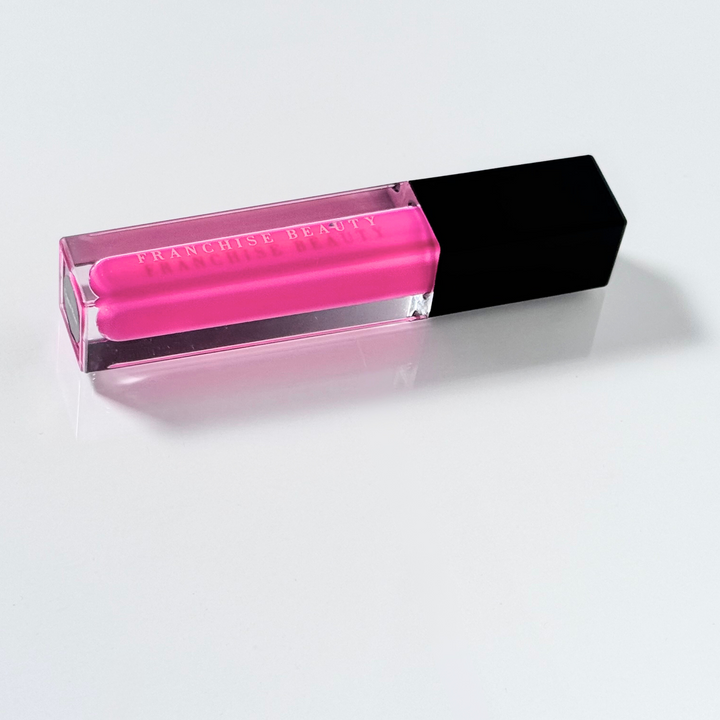 Crystal Rose vibrant fuchsia lip gloss in clear tube with glossy finish