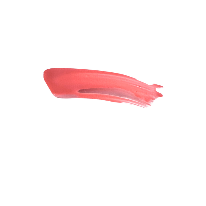 Swatch of Lantana coral lip gloss showing bold, pigmented color with a glossy, smooth finish.