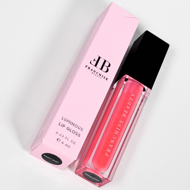 Blush Glass lip gloss in clear tube with sheer pink tint and recyclable packaging