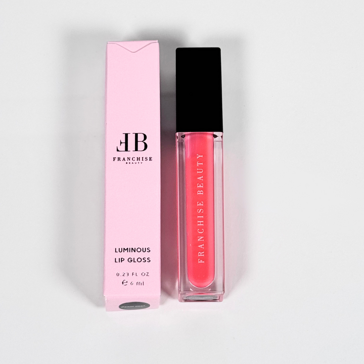 Blush Glass lip gloss in clear tube with sheer pink tint and recyclable packaging