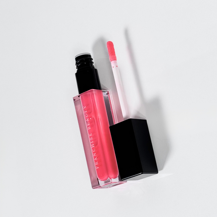Blush Glass lip gloss in clear tube with sheer pink tint and recyclable packaging