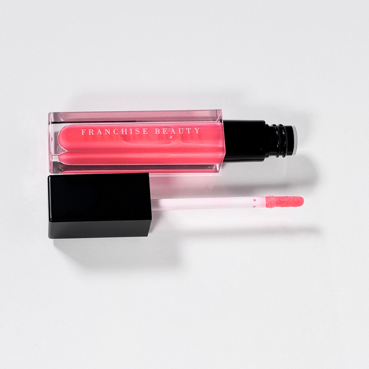 Blush Glass lip gloss in clear tube with sheer pink tint and recyclable packaging