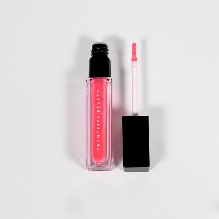 Blush Glass lip gloss in clear tube with sheer pink tint and recyclable packaging