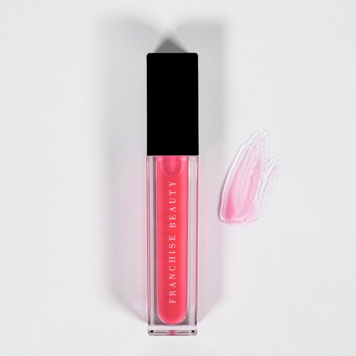 Blush Glass lip gloss in clear tube with sheer pink tint and recyclable packaging