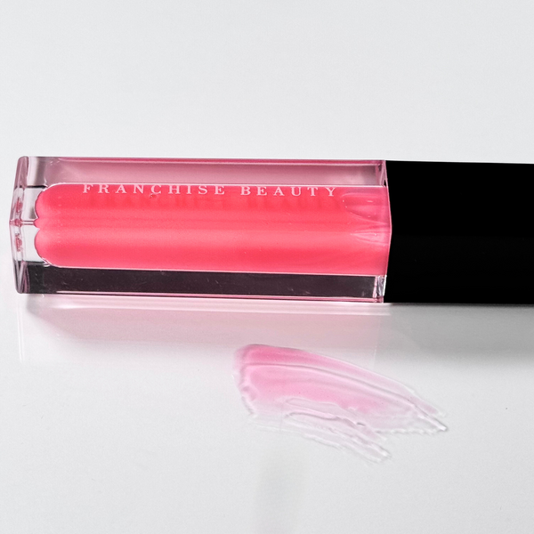 Blush Glass lip gloss in clear tube with sheer pink tint and recyclable packaging