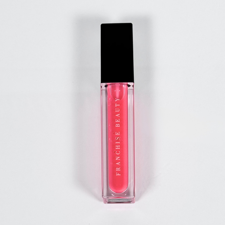 Blush Glass lip gloss in clear tube with sheer pink tint and recyclable packaging