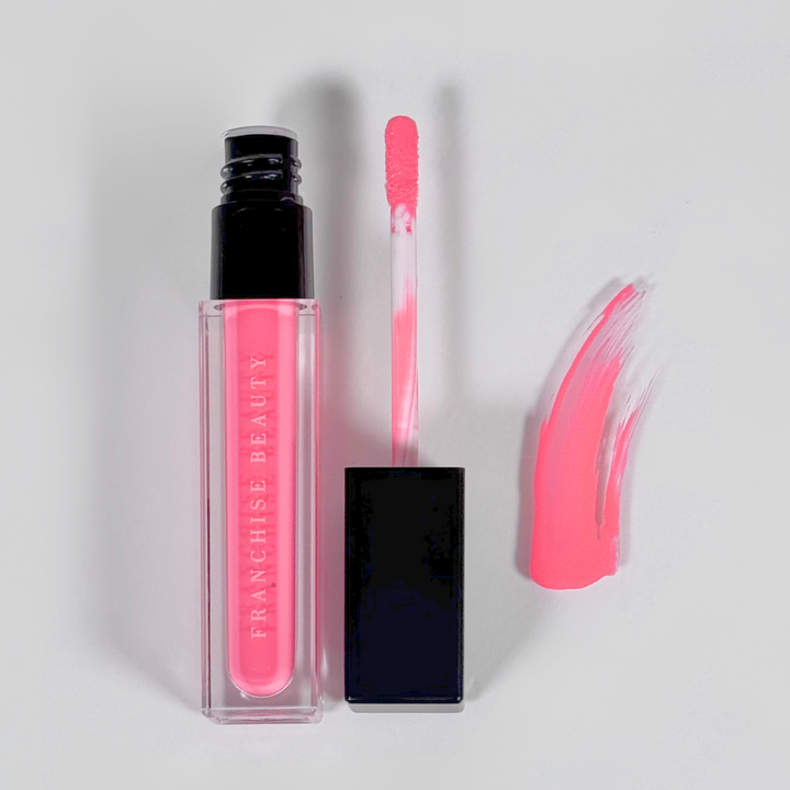 Highly pigmented vibrant pink gloss from Franchise Beauty – cruelty-free and vegan