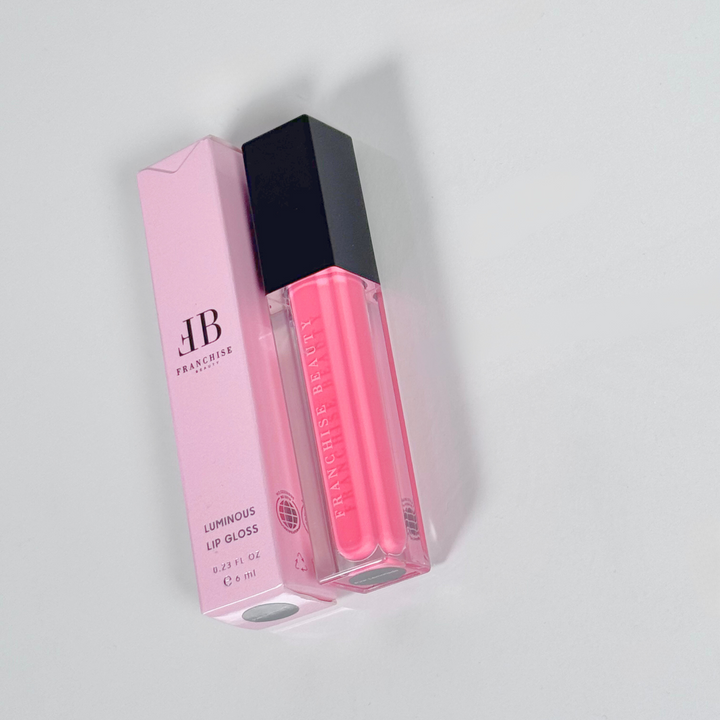 Pink Lemonade vivid pink lip gloss in clear tube with recyclable packaging