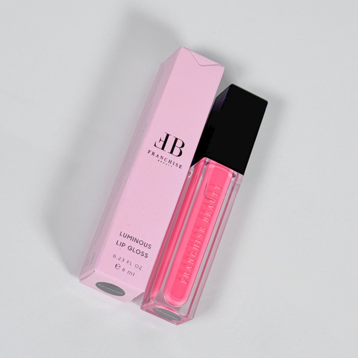 Pink Lemonade vivid pink lip gloss in clear tube with recyclable packaging