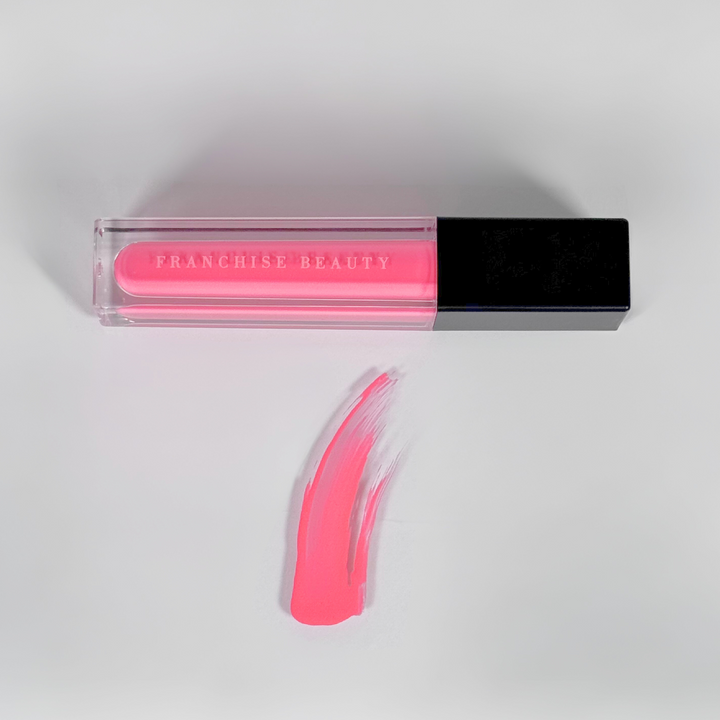 Highly pigmented vibrant pink gloss from Franchise Beauty – cruelty-free and vegan