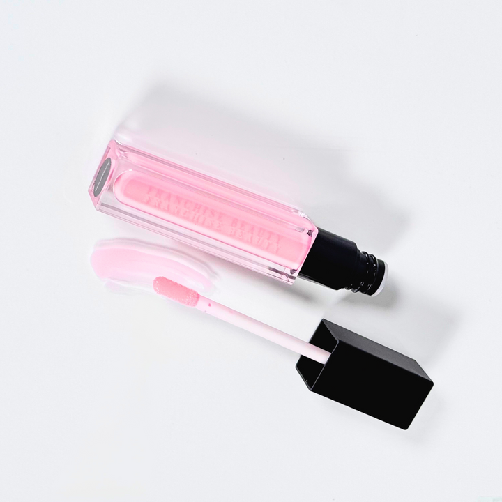 Porcelain Rose baby pink sheer lip gloss in clear tube