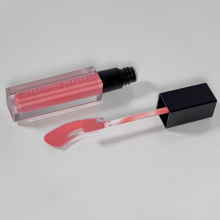 Sugar Coral pigmented coral nude lip gloss in recyclable tube – vegan and cruelty-free