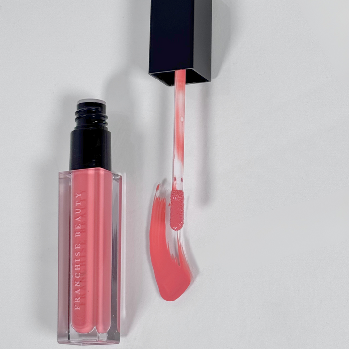 Sugar Coral pigmented coral nude lip gloss in recyclable tube – vegan and cruelty-free