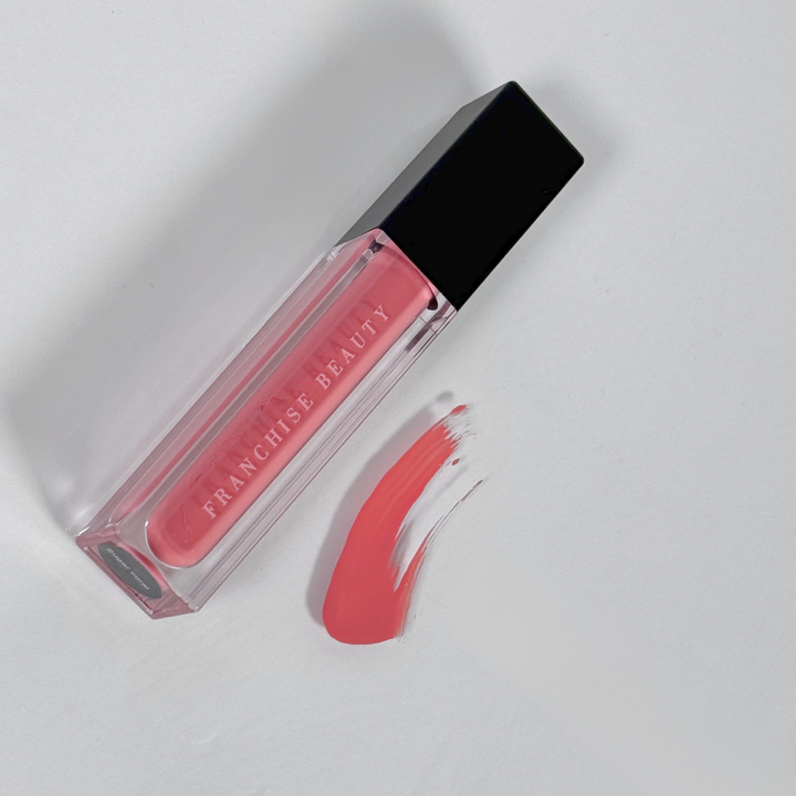 Sugar Coral pigmented coral nude lip gloss in recyclable tube – vegan and cruelty-free