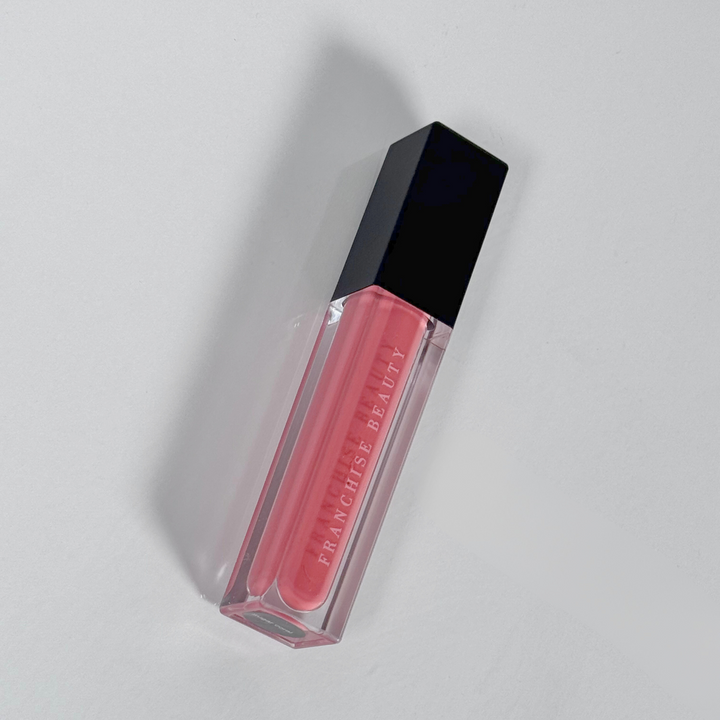 Sugar Coral pigmented coral nude lip gloss in recyclable tube – vegan and cruelty-free